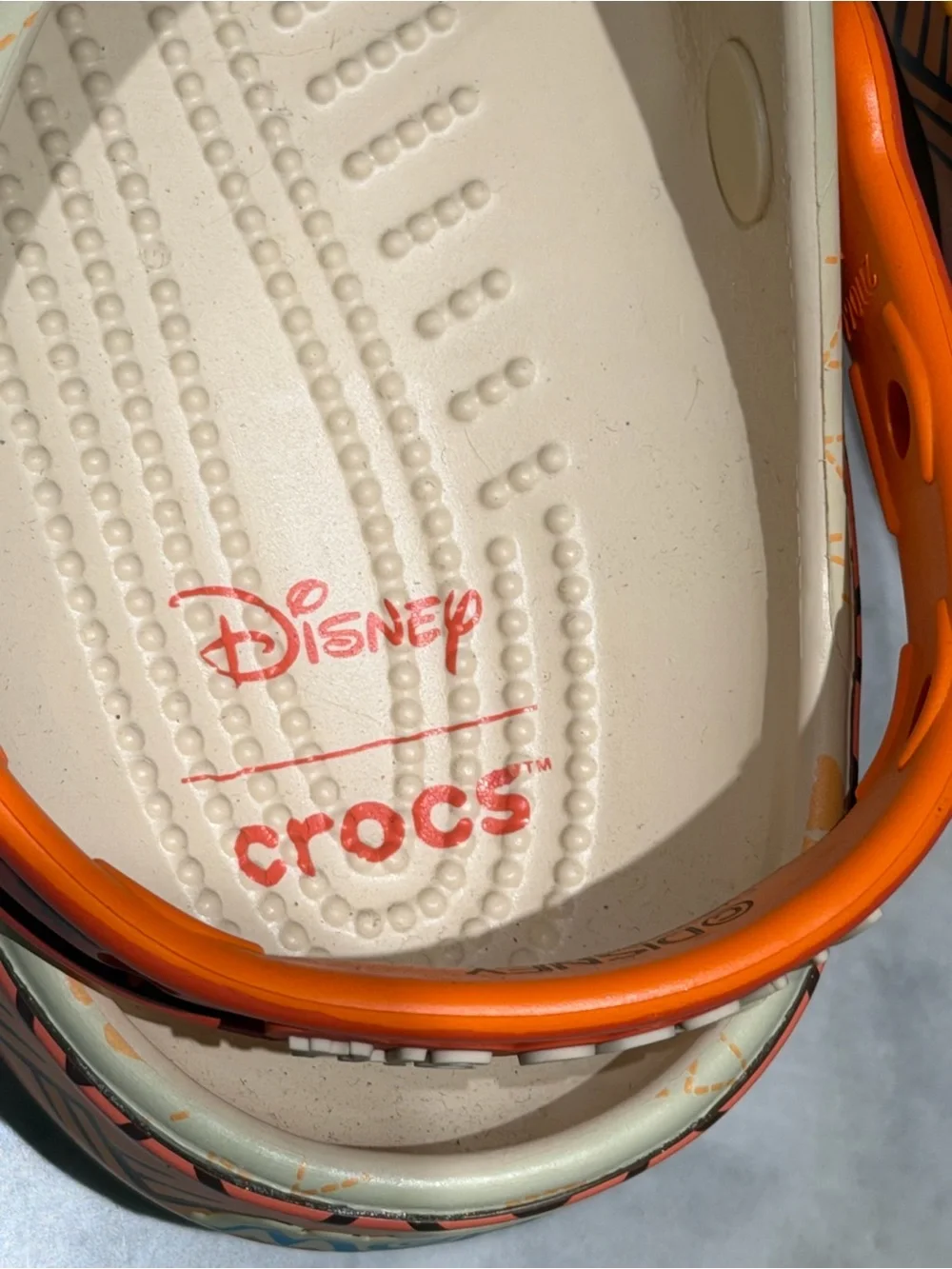 CROCS Kids Beige Orange Floral Moana Themed Clogs with Blue and orange Charms